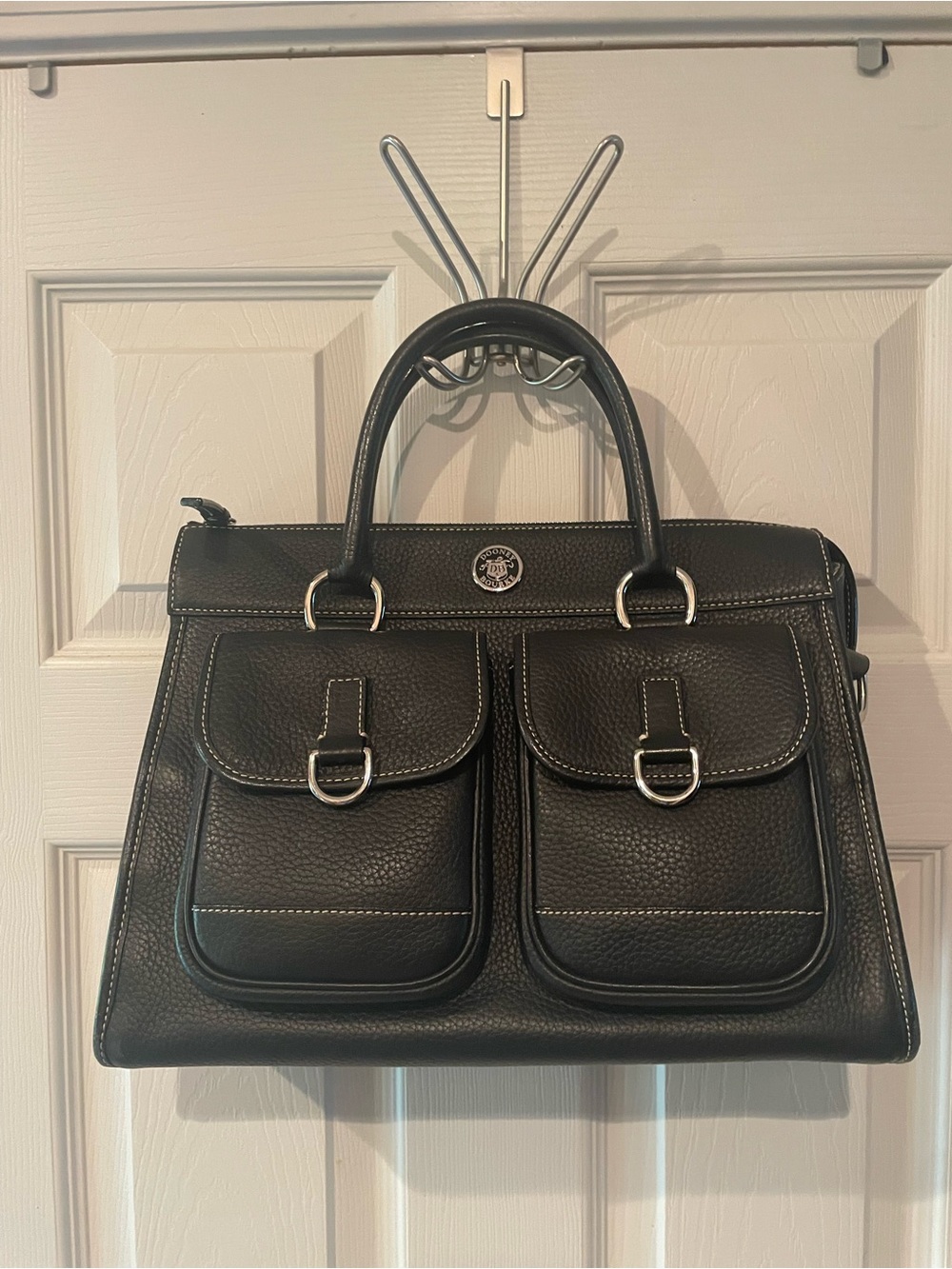 Dooney & Bourke pebbled Leather Satchel Bag with nickel hardware. No strap.